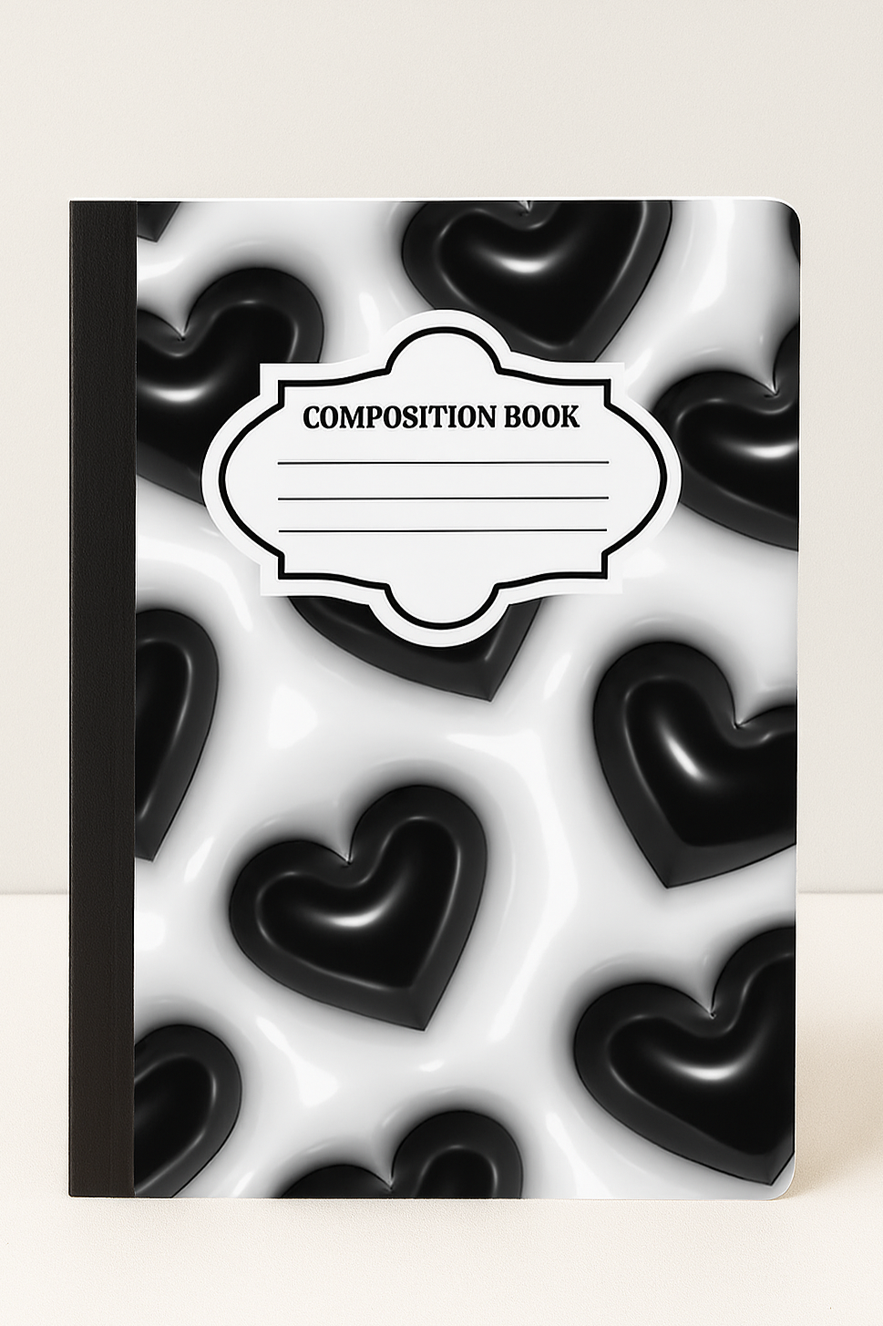 A standard 7.5x9.75 composition notebook with a bold black 3D heart pattern on a glossy white background, designed for school, journaling, or creative writing.