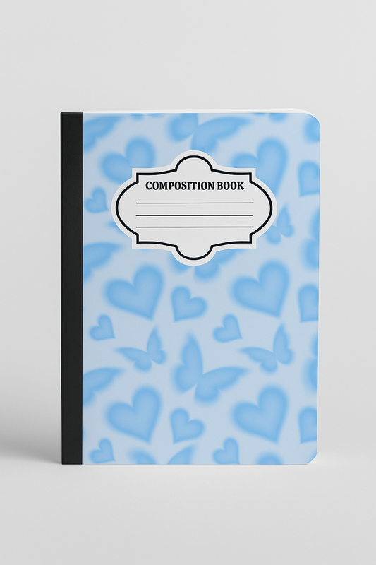 A soft pastel blue composition notebook with a repeating pattern of blurred hearts and butterflies, featuring a classic label design.
