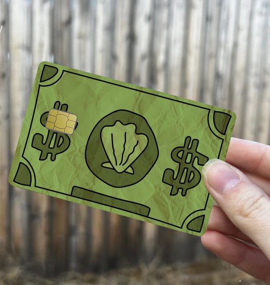 Green credit card cover designed like cartoon sea money with shell icon and dollar signs, wrinkled paper texture, standard card size
